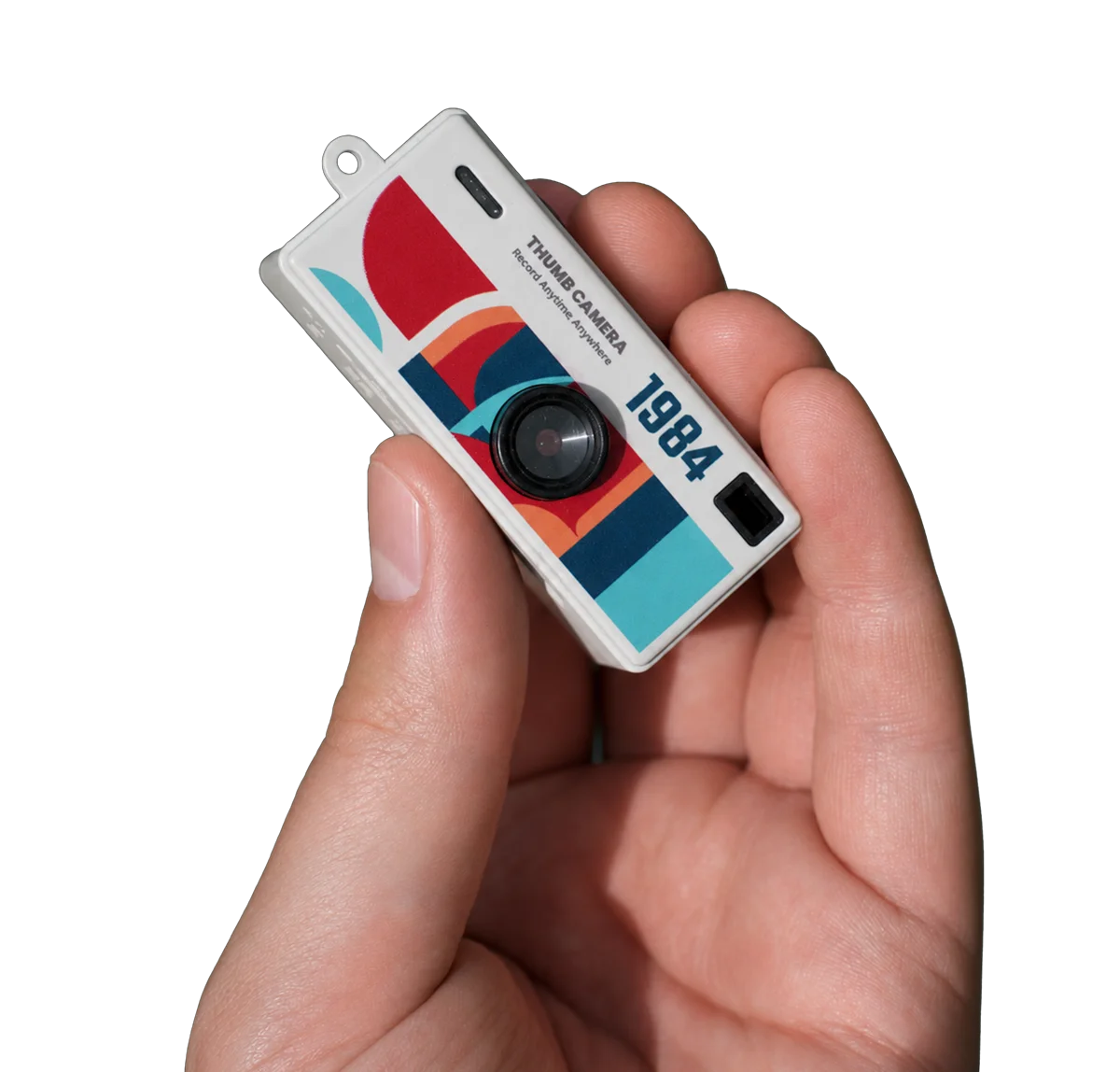 ShutterShare mini camera held between two fingers — thumb-sized