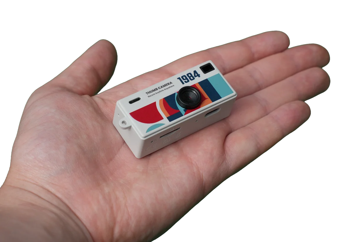 ShutterShare mini camera resting in the palm of a hand — shows scale